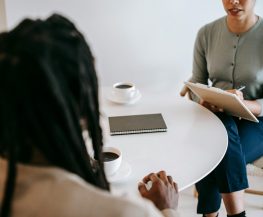 Tutor conducting consultation with parent to discuss study plan